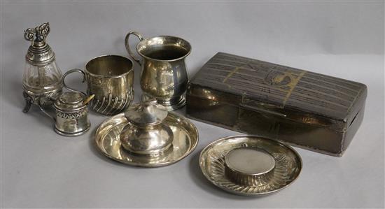 A silver cigarette box, a silver christening mug, a silver cup and saucer, inkwell, condiment and pepper mill etc.